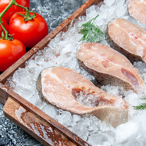 bottom-view-raw-fish-slices-with-ice-on-wood-board-2023-11-27-05-21-45-utc